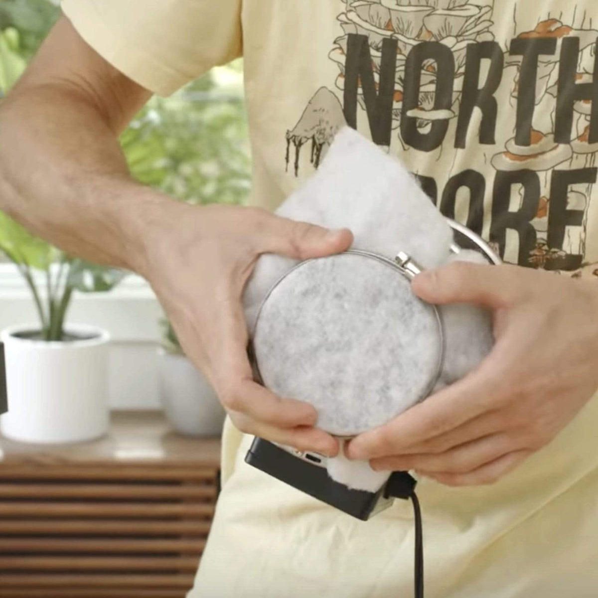 A filter being clamped to a FAE Fan for filtering spores